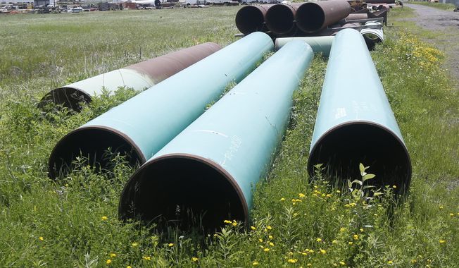 FILE - In this June 29, 2018, file photo, pipeline used to carry crude oil is shown at the Superior, Wis., terminal of Enbridge Energy. A significant permit has been granted to Enbridge&#x27;s plan to replace its aging Line 3 oil pipeline across northern Minnesota. (AP Photo/Jim Mone, File)