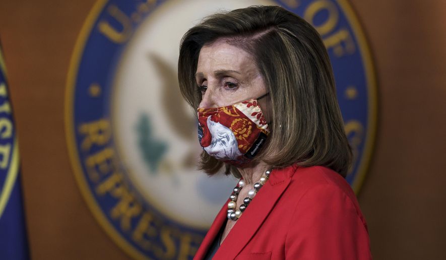 In this Nov. 6, 2020, photo, House Speaker Nancy Pelosi (D-Calif.) pauses as she meets with reporters at the Capitol in Washington about the impact of the election on the political landscape in Congress. (AP Photo/J. Scott Applewhite) **FILE**