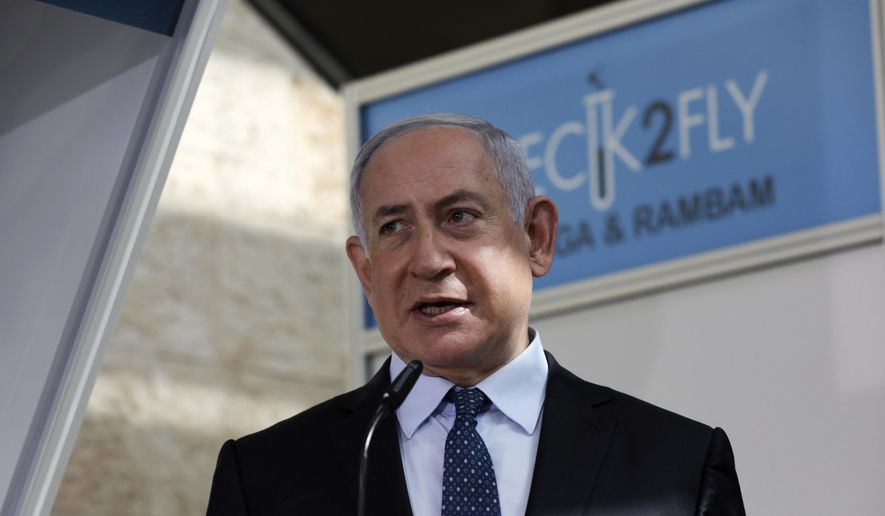 In this Nov. 9, 2020, file photo, Israeli Prime Minister Benjamin Netanyahu visits a new coronavirus lab at Ben-Gurion International Airport, near Tel Aviv, Israel. Israeli media reported Monday, Nov. 23, 2020, that Netanyahu flew to Saudi Arabia for a clandestine meeting with Crown Prince Mohammed bin Salman, which would mark the first known encounter between senior Israeli and Saudi officials. (Ohad Zwigenberg/Pool Photo via AP, File)  **FILE**