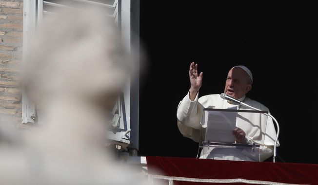 Pope Francis delivers his blessing during the Angelus noon prayer he recited from the window of his studio overlooking St.Peter&#x27;s Square, at the Vatican, Sunday, Nov. 22, 2020. (AP Photo/Alessandra Tarantino) **FILE**