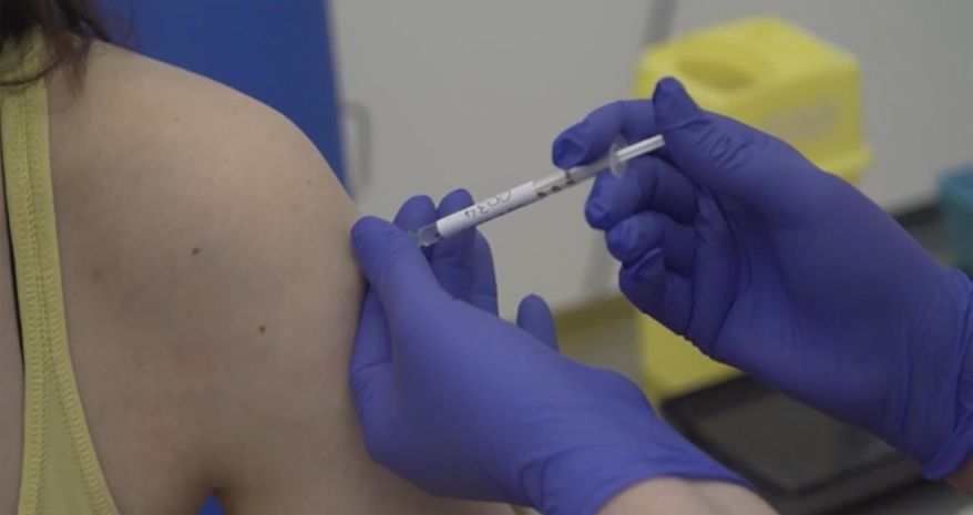This Thursday, April 23, 2020, file screen grab taken from video issued by Britain&#39;s Oxford University shows a person being injected as part of the first human trials in the U.K. to test a potential coronavirus vaccine, untaken by Oxford University in England. AstraZeneca says late-stage trials of its COVID-19 vaccine were “highly effective’’ in preventing disease. A vaccine developed by AstraZeneca and the University of Oxford prevented 70% of people from developing the coronavirus in late-stage trials, the team reported Monday, Nov. 23, 2020. (Oxford University Pool via AP, File)