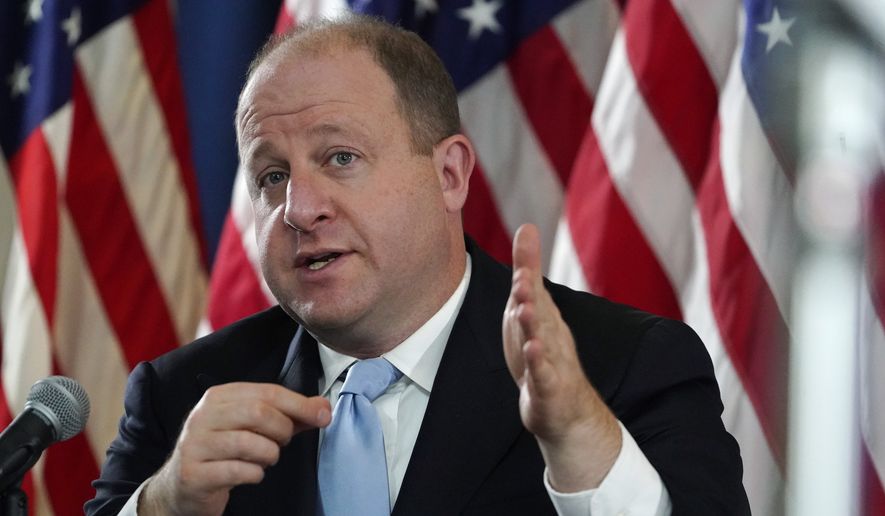 Colorado Gov. Jared Polis speaks during a news conference about the state's response to the rapid increase in COVID-19 cases, Tuesday, Nov. 24, 2020, in Denver. (AP Photo/David Zalubowski)