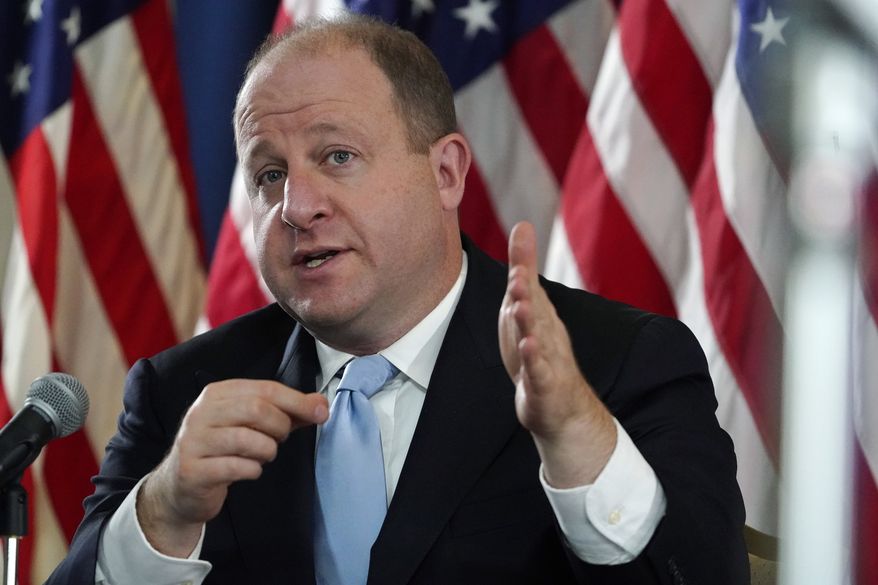 Colorado Gov. Jared Polis speaks during a news conference about the state's response to the rapid increase in COVID-19 cases, Tuesday, Nov. 24, 2020, in Denver. (AP Photo/David Zalubowski)