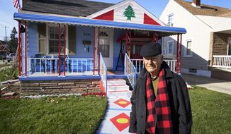 Samih Zreik stands in front of his house, Thursday, Nov. 19, 2020, in Dearborn, Mich. Zreik painted his house in tribute to Lebanon following the blast at Beirut&#39;s port that killed nearly 200 people, wounded more than 6,000 and caused billions of dollars in damage. (AP Photo/Carlos Osorio)