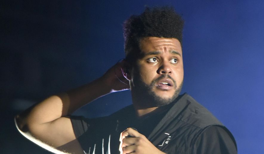 The Weeknd performs on day three at Lollapalooza in Chicago on Aug 4, 2018. The Weeknd, who was nominated for eight American Music Awards, was completely shut out of the Grammys, earning zero nominations despite having a No. 1 album. (Photo by Rob Grabowski/Invision/AP, File)