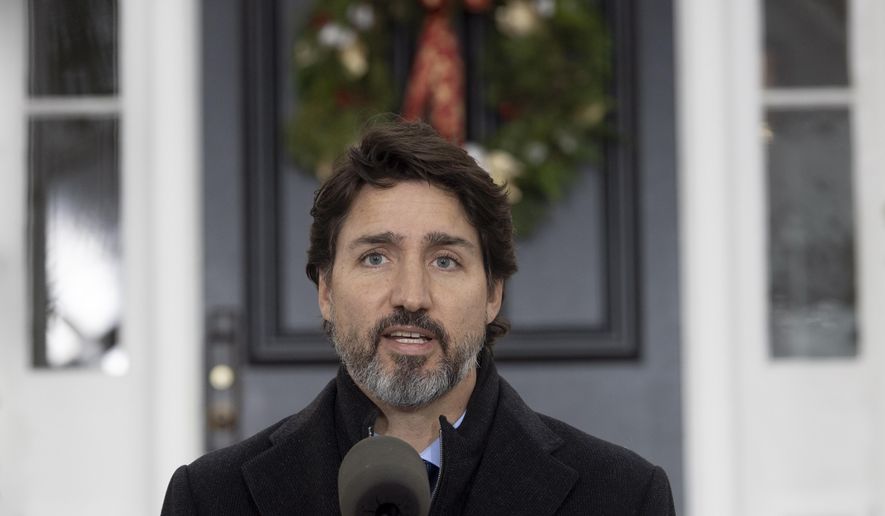 Prime Minister Justin Trudeau speak to the media about the COVID-19 virus outside Rideau Cottage in Ottawa, Friday, Nov. 20, 2020.  (Adrian Wyld/The Canadian Press via AP)