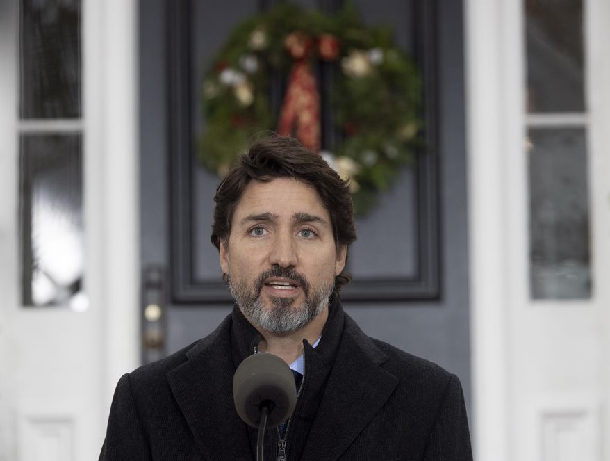 Prime Minister Justin Trudeau speak to the media about the COVID-19 virus outside Rideau Cottage in Ottawa, Friday, Nov. 20, 2020.  (Adrian Wyld/The Canadian Press via AP)