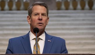 Brian Kemp holds a news conference on the current state of COVID-19, Tuesday, Nov. 24, 2020 at the Georgia State Capitol in Atlanta.  (Ben Gray /Atlanta Journal-Constitution via AP)