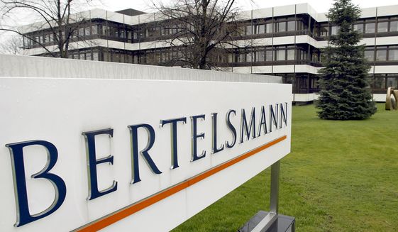 This March 13, 2003 file photo shows an exterior view of the German media giant Bertelsmann in Guetersloh, Germany. German media giant Bertelsmann said Wednesday that it is buying publisher Simon &amp; Schuster from ViacomCBS for $2.17 billion in cash. (AP Photo/Michael Sohn, file)  **FILE**