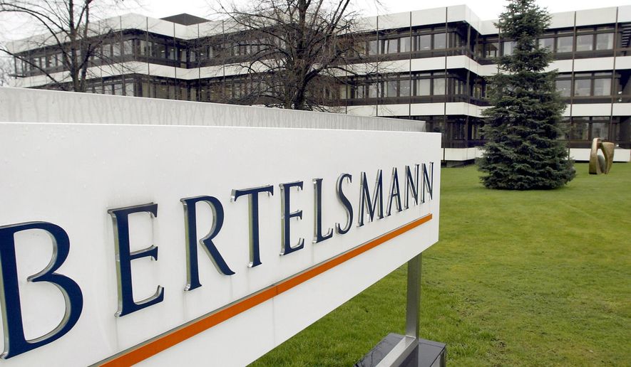 FILE -- This March 13, 2003 file photo shows an exterior view of the German media giant Bertelsmann in Guetersloh, Germany. German media giant Bertelsmann said Wednesday that it is buying publisher Simon &amp;amp; Schuster from ViacomCBS for $2.17 billion in cash. (AP Photo/Michael Sohn, file)