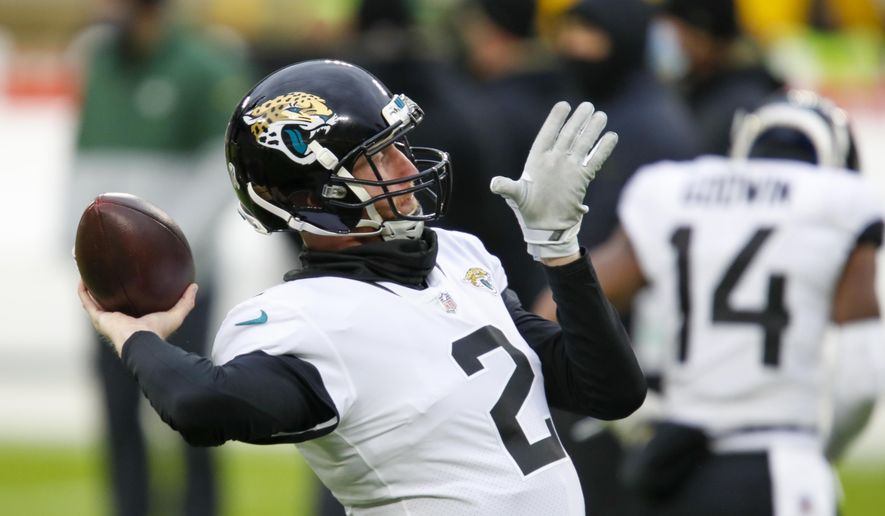 Jacksonville Jaguars&#39; Mike Glennon warms up before an NFL football game against the Green Bay Packers Sunday, Nov. 15, 2020, in Green Bay, Wis. (AP Photo/Matt Ludtke)