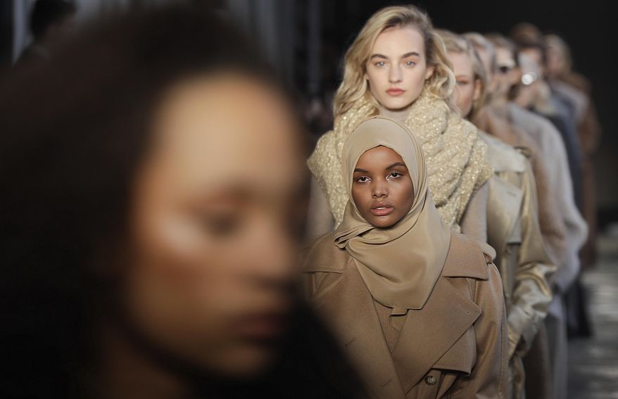 FILE - In this Feb. 23, 2017 file photo, Somali-American model Halima Aden wears a creation part of the Max Mara women&#39;s Fall-Winter 2017-18 collection, that was presented in Milan, Italy. Somali-American model Halima Aden has announced that she is taking a step back from the fashion industry, saying that the pandemic slowdown has given her time to see instances when her desire to maintain a hijab was not properly respected. (AP Photo/Luca Bruno).