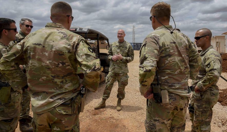 U.S. Army Brig. Gen. Damian T. Donahoe, deputy commanding general, Combined Joint Task Force - Horn of Africa, center, talks with service members during a battlefield circulation Saturday, Sept. 5, 2020, in Somalia. No country has been involved in Somalia&#39;s future as much as the United States but now the Trump administration is thinking of withdrawing the several hundred U.S. military troops from the nation at what some experts call the worst possible time. (Senior Airman Kristin Savage/Combined Joint Task Force - Horn of Africa via AP)