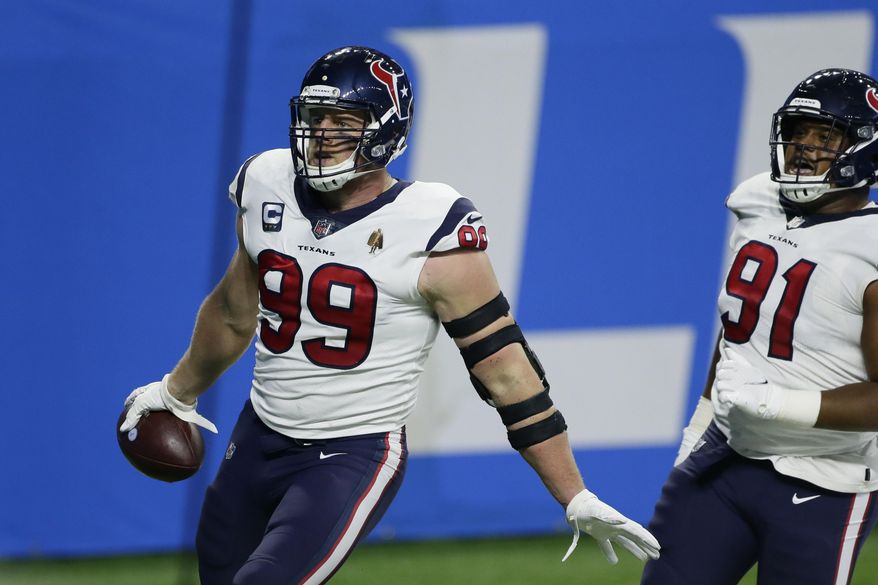 Houston Texans defensive end J.J. Watt (99) runs into the end zone for a touchdown after incepting a pass intended for Detroit Lions fullback Jason Cabinda during the first half of an NFL football game, Thursday, Nov. 26, 2020, in Detroit. (AP Photo/Duane Burleson)