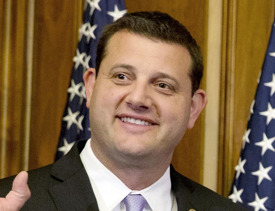 In this Jan. 6, 2015, file photo, Rep. David Valadao, R-Calif., poses during a ceremonial re-enactment of his swearing-in ceremony in the Rayburn Room on Capitol Hill in Washington. Valadao has reclaimed the U.S. House seat he lost in the California farm belt two years ago. (AP Photo/Jacquelyn Martin, File)  **FILE**
