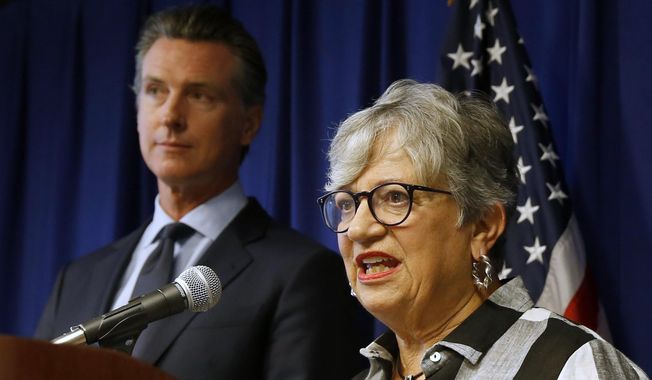 FILE - In this Sept. 18, 2019, file photo, California Air Resources Board Chair Mary Nichols, with California Gov. Gavin Newsom at left, discusses the Trump administration&#x27;s pledge to revoke California&#x27;s authority to set vehicle emissions standards that are different than the federal standards, during a news conference in Sacramento, Calif. Nichols&#x27; term leading the state ARB ends in December 2020. She&#x27;s held the role since 2007 after an earlier stint as chair in the early 1980s. (AP Photo/Rich Pedroncelli, File)