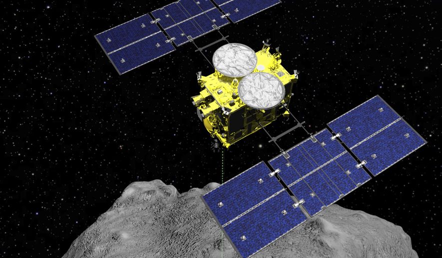 FILE - This computer graphics image released by the Japan Aerospace Exploration Agency (JAXA) shows the Hayabusa2 spacecraft above the asteroid Ryugu. The Japanese spacecraft is nearing Earth after a yearlong journey home from a distant asteroid carrying soil samples and data that could provide clues to the origins of the solar system, a space agency official said Friday, Nov. 27, 2020. (ISAS/JAXA via AP, File)