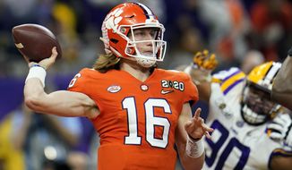 FILE - In this Jan. 13, 2020, file photo, Clemson quarterback Trevor Lawrence throws a pass against LSU during the first half of a NCAA College Football Playoff national championship game in New Orleans. The college quarterbacks class is shaping up nicely, just in time to perhaps rescue some NFL teams from themselves. (AP Photo/David J. Phillip, File)
