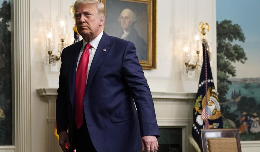 President Donald Trump departs after participating in a video teleconference call with members of the military on Thanksgiving, Thursday, Nov. 26, 2020, at the White House in Washington. (AP Photo/Patrick Semansky)