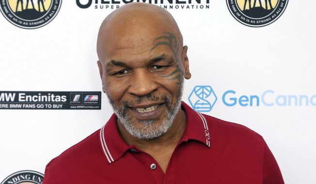 FILE - In this Aug. 2, 2019, file photo, Mike Tyson attends a celebrity golf tournament in Dana Point, Calif. Tyson and Roy Jones Jr. are older, wiser, calmer men than the superstars who dominated their sport. Their fight at Staples Center on Saturday night, Nov. 28, is an eight-round exhibition bout with no official judging and limited violence, although the limit depends on whether you&#x27;re asking the fighters or the California State Athletic Commission. For Tyson and Jones, this unique pay-per-view boxing match is less of a sporting event and more of a chance for two transcendent athletes to prove age is a number and aging is a choice. (Photo by Willy Sanjuan/Invision/AP, File)