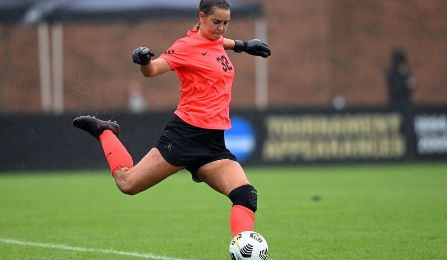 In this image provided by Vanderbilt Athletics, Vanderbilt goalkeeper Sarah Fuller kicks a goal kick during an NCAA college soccer game against South Carolina on Oct. 11, 2020, in Nashville, Tenn. Fuller will don a football uniform on Vanderbilt's sideline and she is poised to become the first woman to play in a Power 5 game when the Commodores take on Missouri on Sarturday. (Eric Glemser/Vanderbilt Athletics via AP)