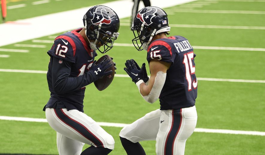 Houston Texans wide receiver Kenny Stills (12) celebrates his touchdown catch against the Minnesota Vikings with teammate Will Fuller (15) during the second half of an NFL football game Sunday, Oct. 4, 2020, in Houston. (AP Photo/Eric Christian Smith)