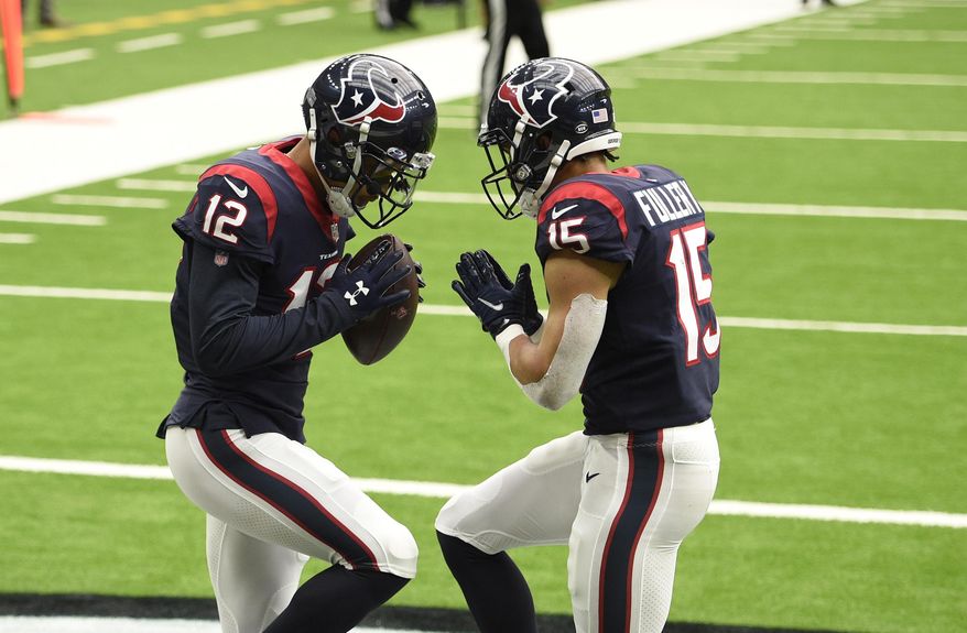Houston Texans wide receiver Kenny Stills (12) celebrates his touchdown catch against the Minnesota Vikings with teammate Will Fuller (15) during the second half of an NFL football game Sunday, Oct. 4, 2020, in Houston. (AP Photo/Eric Christian Smith)