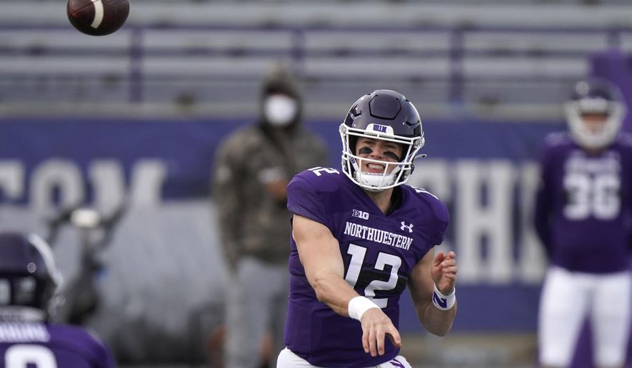 Northwestern quarterback Peyton Ramsey throws a pass during the first half of an NCAA college football game against Wisconsin in Evanston, Ill., Saturday, Nov. 21, 2020. Northwestern won 17-7. (AP Photo/Nam Y. Huh)