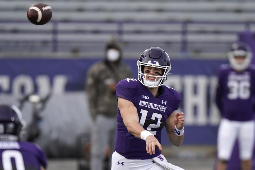 Northwestern quarterback Peyton Ramsey throws a pass during the first half of an NCAA college football game against Wisconsin in Evanston, Ill., Saturday, Nov. 21, 2020. Northwestern won 17-7. (AP Photo/Nam Y. Huh)