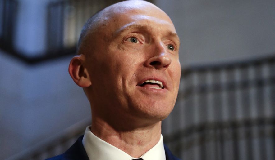 In this Nov. 2, 2017, photo, Carter Page, a foreign policy adviser to Donald Trump&#39;s 2016 presidential campaign, speaks with reporters following a day of questions from the House Intelligence Committee, on Capitol Hill in Washington. (AP Photo/J. Scott Applewhite)  **FILE**