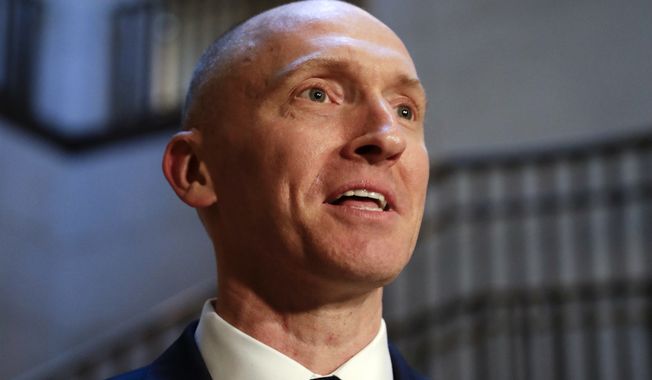 In this Nov. 2, 2017, photo, Carter Page, a foreign policy adviser to Donald Trump&#x27;s 2016 presidential campaign, speaks with reporters following a day of questions from the House Intelligence Committee, on Capitol Hill in Washington. (AP Photo/J. Scott Applewhite)  **FILE**