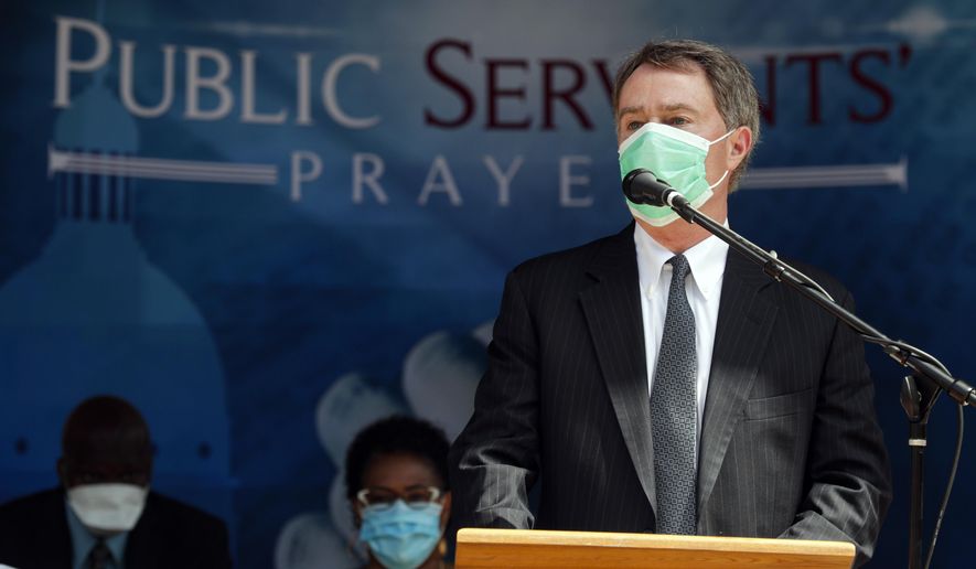 Indianapolis Mayor Joe Hogsett offers a prayer during a prayer service in Indianapolis, Wednesday, June 3, 2020. Elected officials, community leaders and religious leaders gathered to pray for the city. Protesters are expected to gather for the sixth straight night in Indianapolis since the death of George Floyd, a black man who died after he was restrained in police custody in Minneapolis on May 25. (AP Photo/Michael Conroy)