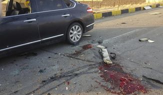 This photo released by the semi-official Fars News Agency shows the scene where Mohsen Fakhrizadeh was killed in Absard, a small city just east of the capital, Tehran, Iran, Friday, Nov. 27, 2020.  Fakhrizadeh, an Iranian scientist that Israel alleged led the Islamic Republic&#39;s military nuclear program until its disbanding in the early 2000s was “assassinated” Friday, state television said.  (Fars News Agency via AP)