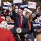  In this Nov. 20, 2020, file photo Vice President Mike Pence and Kelly Loeffler wave to the crowd during a Defend the Majority Rally in Canton, Ga. U.S. Sen. Kelly Loeffler waves behind Pence. (AP Photo/Ben Gray, File) ** FILE **
