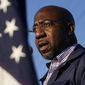 In this Nov. 15, 2020, file photo, Raphael Warnock, a Democratic candidate for the U.S. Senate, speaks during a campaign rally in Marietta, Ga. Warnock and U.S. Sen. Kelly Loeffler are in a runoff election for the Senate seat. (AP Photo/Brynn Anderson, File)  ** FILE **