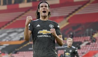 Manchester United&#x27;s Edinson Cavani celebrates after scoring his side&#x27;s second goal during an English Premier League soccer match between Southampton and Manchester United at the St. Mary&#x27;s stadium in Southampton, England, Sunday, Nov. 29, 2020. (Mike Hewitt, Pool via AP)