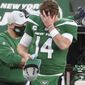 New York Jets quarterback Sam Darnold (14) puts on a cap after he threw an interception, his second of the game, in the fourth quarter against the Miami Dolphins on Sunday, Nov. 29, 2020, in East Rutherford, N.J. (Andrew Mills/NJ Advance Media via AP)