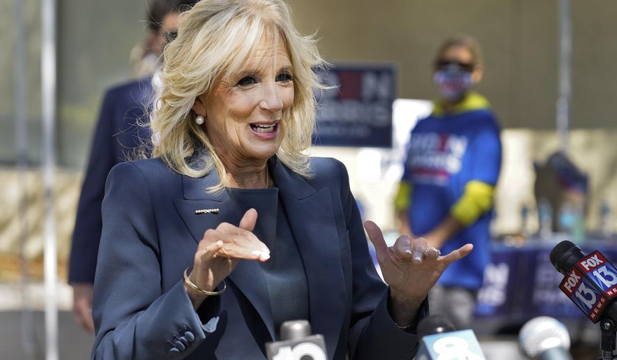 Jill Biden speaks to reporters while campaigning for her husband Democratic presidential candidate and former Vice President Joe Biden, during a voting poll meet and greet Tuesday, Nov. 3, 2020, in St. Petersburg, Fla. (AP Photo/Chris O&#39;Meara)