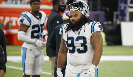 Carolina Panthers defensive tackle Bravvion Roy (93) walks off the field after an NFL football game against the Minnesota Vikings, Sunday, Nov. 29, 2020, in Minneapolis. The Vikings won 28-27. (AP Photo/Bruce Kluckhohn)
