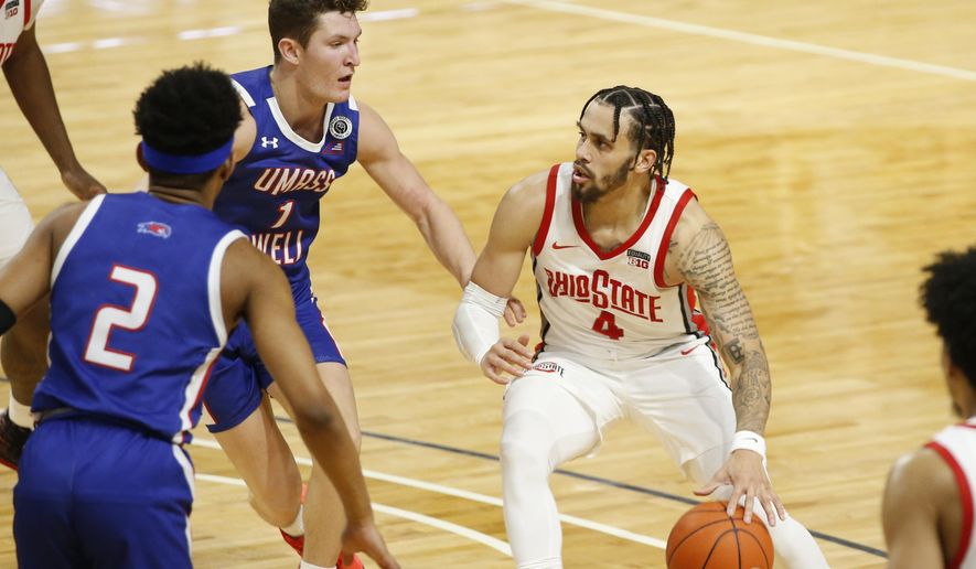 Ohio State&#39;s Duane Washington, right, drives to the basket against UMass-Lowell&#39;s Bryce Daley during the second half of an NCAA college basketball game Sunday, Nov. 29, 2020, in Columbus, Ohio. (AP Photo/Jay LaPrete)