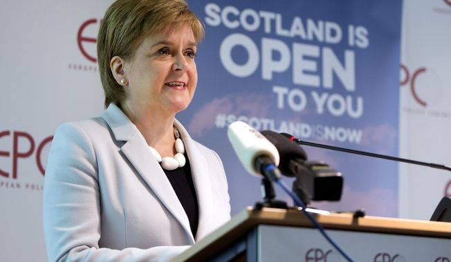 FILE - In this Tuesday, June 11, 2019 file photo, Scotland&#x27;s First Minister Nicola Sturgeon speaks during an event in Brussels. Scotland’s pro-independence leader said Monday, Nov. 30, 2020 that she hopes to hold a referendum on independence from Britain as early as next year, setting up a political showdown with a U.K. government that refuses to countenance a secession vote. (AP Photo/Virginia Mayo, file)