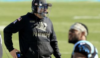 Carolina Panthers head coach Matt Rhule sets up before the first half of an NFL football game between the Carolina Panthers and the Tampa Bay Buccaneers, Sunday, Nov. 15, 2020, in Charlotte , N.C. (AP Photo/Brian Blanco)