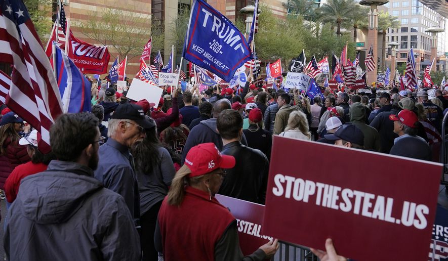 Supporters of President Donald Trump protest in front of a local hotel where Arizona Republicans have scheduled a meeting as a &amp;quot;fact-finding hearing&amp;quot; to discuss the election, featuring members of Trump&#39;s legal team and Arizona legislators, Monday, Nov. 30, 2020, in Phoenix. (AP Photo/Ross D. Franklin) **FILE**