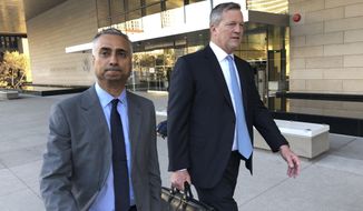 FILE - In this Nov. 22, 2019 file photo, Imaad Zuberi, left, leaves the federal courthouse in Los Angeles with his attorney Thomas O&#39;Brien, right, after pleading guilty to funneling donations from foreigners to U.S. political campaigns.  Zuberi, an elite political fundraiser, had the ear of top Democrats and Republicans alike — a reach that included private meetings with then-Vice President Joe Biden and VIP access at Donald Trump’s inauguration. But federal prosecutors say Zuberi’s life was built on a series of lies and the lucrative enterprise of filling the campaign coffers of American politicians and profiting from the resulting influence. They describe him as a “mercenary” political donor who gave to anyone -- often using foreign money given through illegal straw donors. (AP Photo/Brian Melley, File)