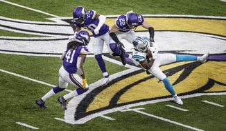 Carolina Panthers wide receiver Curtis Samuel (10) catches a pass over Minnesota Vikings strong safety Harrison Smith (22) on the Panthers last drive of an NFL football game in Minneapolis, Sunday, Nov. 29, 2020. (Jerry Holtz/Star Tribune via AP)