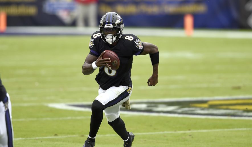 Baltimore Ravens quarterback Lamar Jackson runs with the ball against the Tennessee Titans during the first half of an NFL football game, Sunday, Nov. 22, 2020, in Baltimore. (AP Photo/Gail Burton) **FILE**