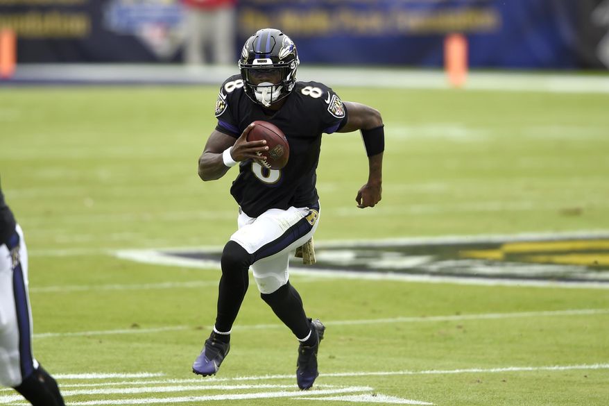 Baltimore Ravens quarterback Lamar Jackson runs with the ball against the Tennessee Titans during the first half of an NFL football game, Sunday, Nov. 22, 2020, in Baltimore. (AP Photo/Gail Burton) **FILE**