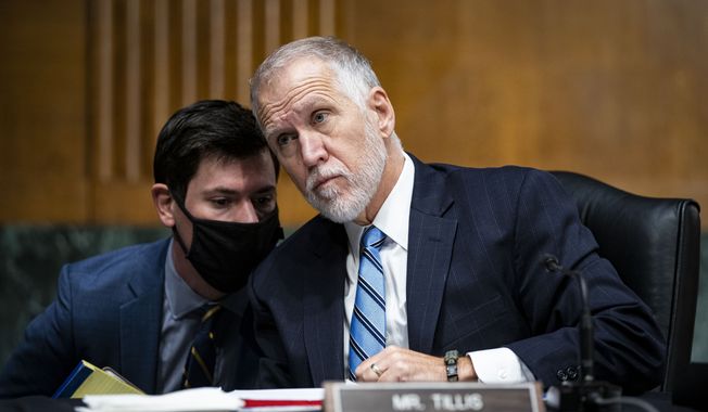 Sen. Thom Tillis, R-N.C., attends a Senate Banking Committee hearing on Capitol Hill, on Tuesday, Dec. 1, 2020, in Washington. (Al Drago/The New York Times via AP, Pool)