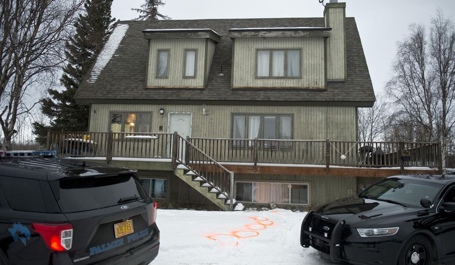 Alaska State Troopers investigate a fatal shooting scene at a home on North Valley Way in Palmer, Alaska, Monday, Nov. 30, 2020. An 18-year-old Alaska man just out of jail for assaulting a family member has been charged with killing four members of his family, including two cousins under the age of 10, charging documents released Tuesday, Dec. 1, 2020 said. (Marc Lester/Anchorage Daily News via AP)