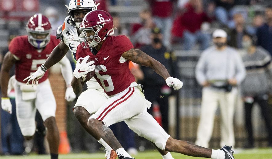 Alabama wide receiver DeVonta Smith (6) breaks free for a touchdown against Auburn during an NCAA college football game Saturday, Nov. 28, 2020, in Tuscaloosa, Ala. (Mickey Welsh/The Montgomery Advertiser via AP)  **FILE**